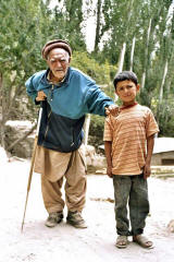 An old (centagenarian ?) Hunza man with his great great grandson